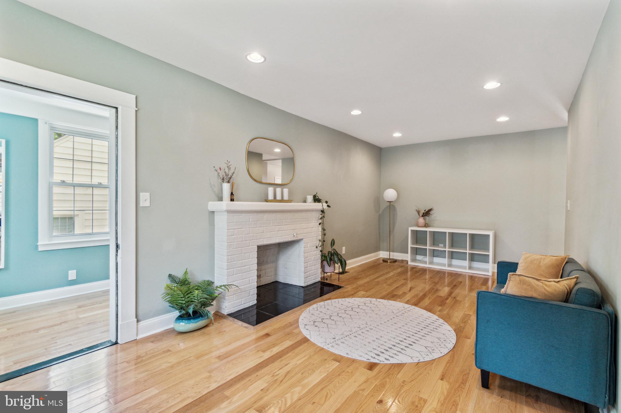 911 Regester Avenue Baltimore, MD 21239 - Photo 3 of 40 Formal living room with wood burning fireplace