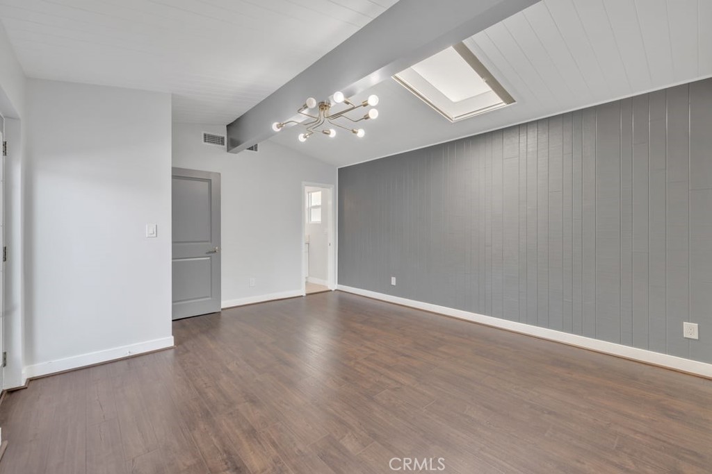 2909 Nipomo Avenue Long Beach, CA 90815 - Photo 16 of 41 a view of an empty room with wooden floor