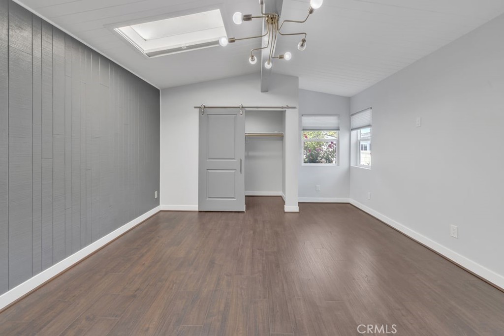 2909 Nipomo Avenue Long Beach, CA 90815 - Photo 17 of 41 wooden floor in an empty room with a window