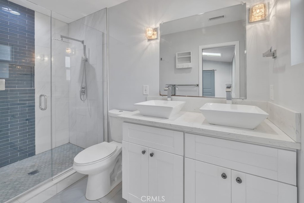 2909 Nipomo Avenue Long Beach, CA 90815 - Photo 19 of 41 a bathroom with a sink toilet and shower