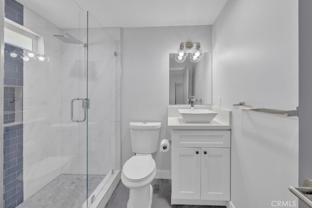 2909 Nipomo Avenue Long Beach, CA 90815 - Photo 25 of 41 a bathroom with a sink toilet and shower