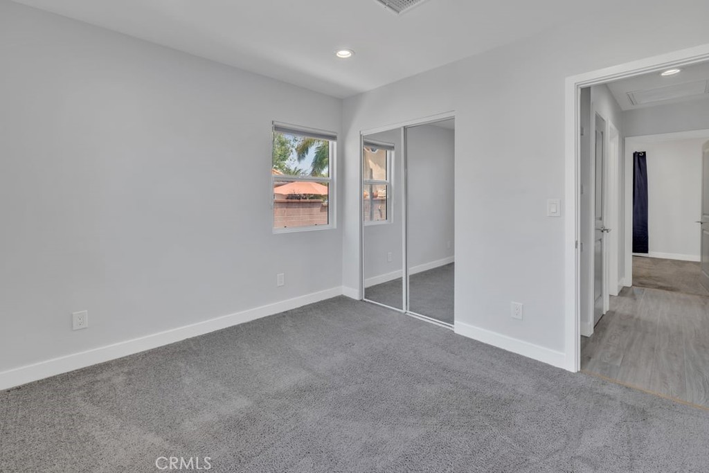 2909 Nipomo Avenue Long Beach, CA 90815 - Photo 32 of 41 an empty room with windows and closet
