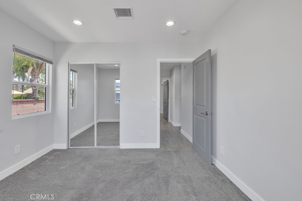 2909 Nipomo Avenue Long Beach, CA 90815 - Photo 33 of 41 an empty room with windows and closet
