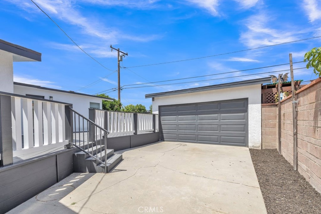 2909 Nipomo Avenue Long Beach, CA 90815 - Photo 40 of 41 a bedroom with a bed and a chandelier