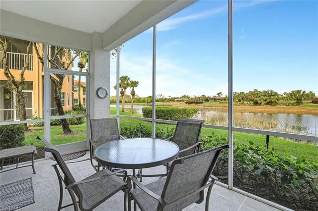 a view of a patio with table and chairs and potted plants