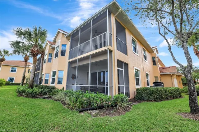 a front view of a building with a garden