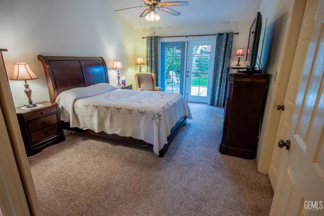 a bed sitting in a bedroom next to a window