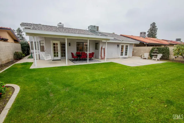 a front view of a house with a garden and porch