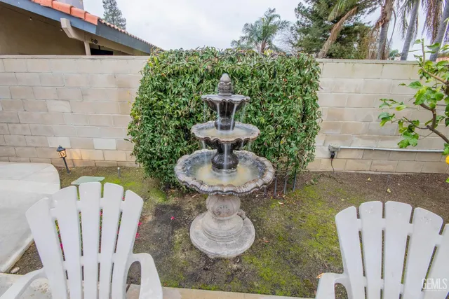 a view of a house with pool and furniture