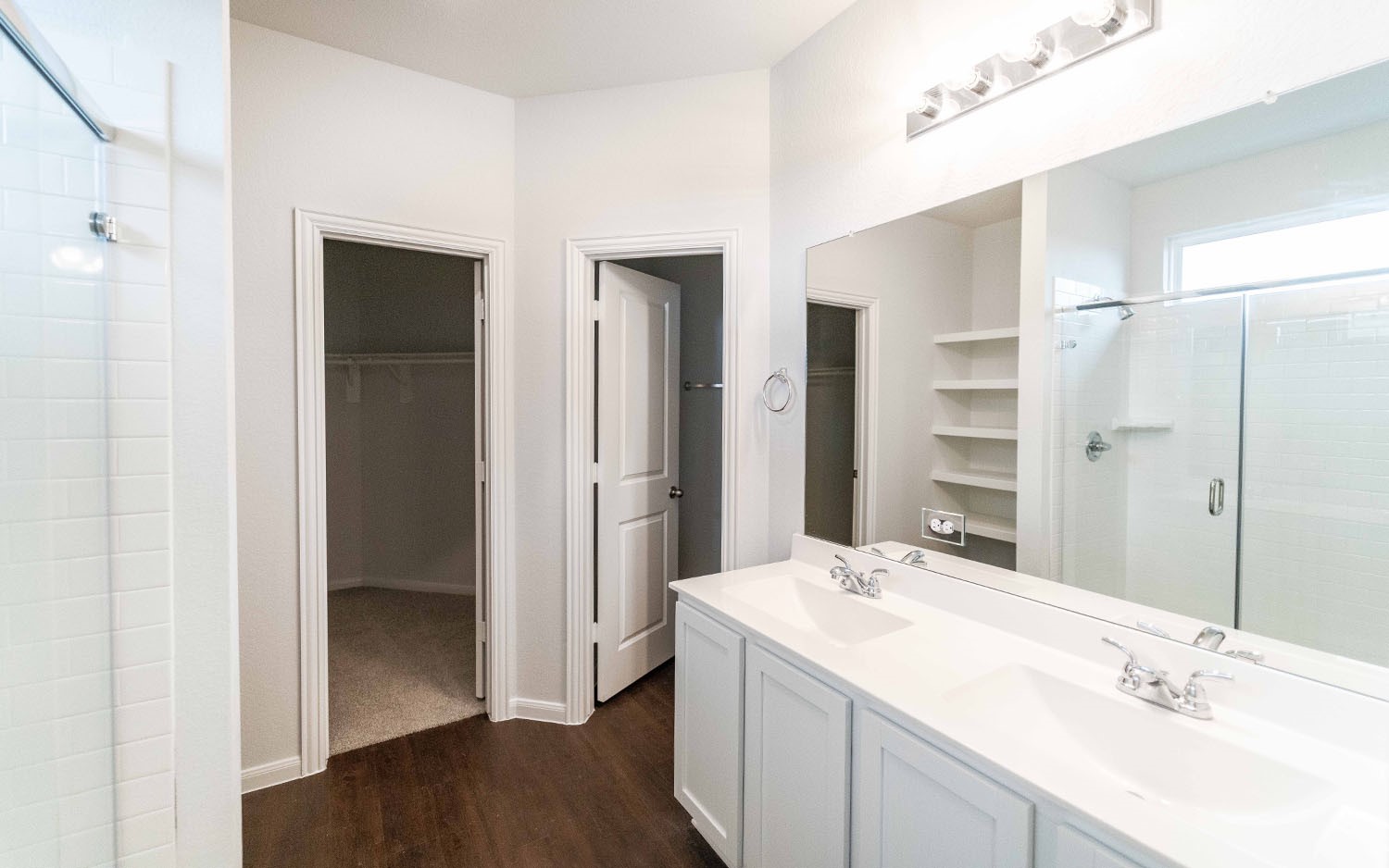 1718 Windrose Bend Angleton, TX 77515 - Photo 7 of 14 a bathroom with a double vanity sink mirror and shower