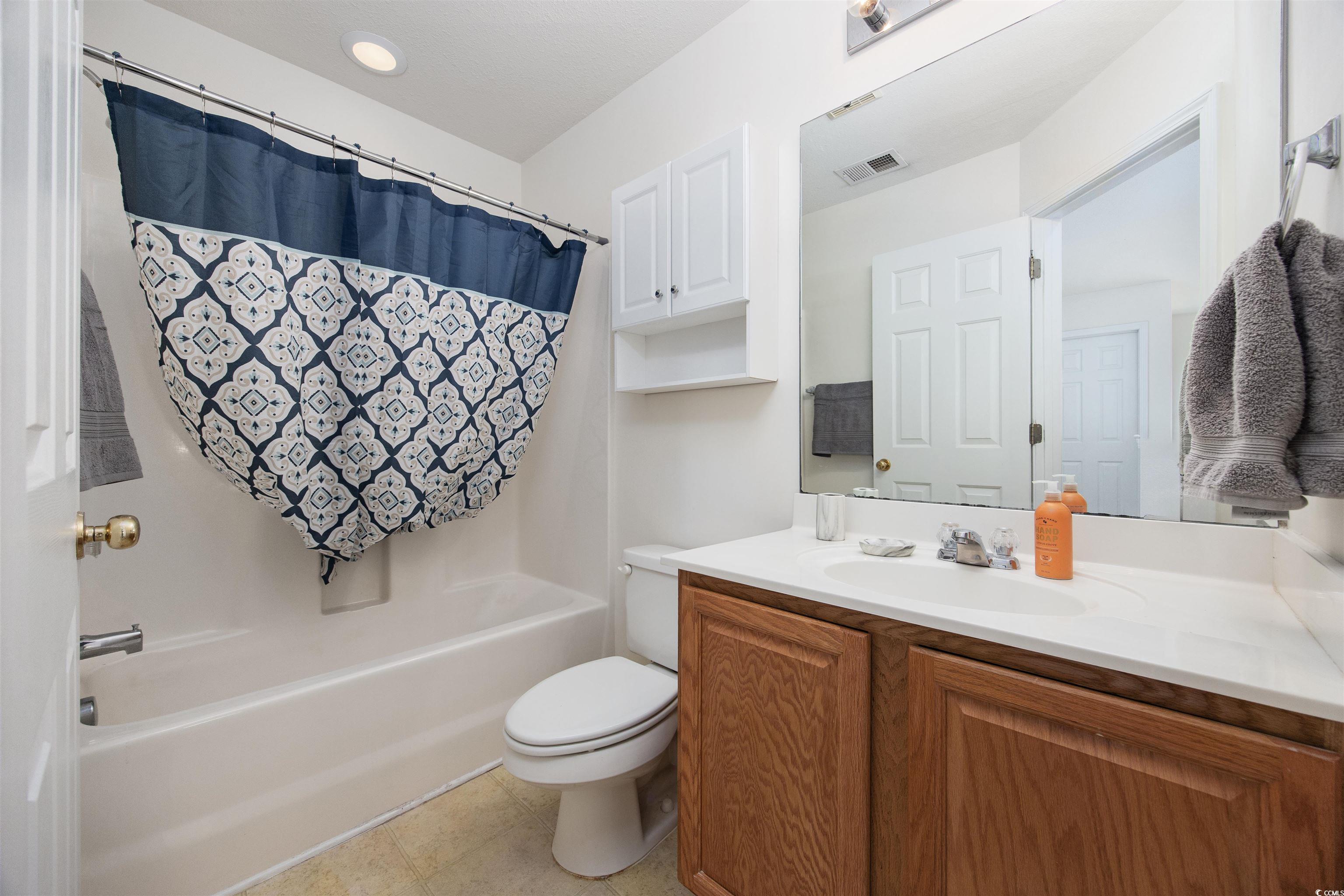 155 Chenoa Drive, Unit D Murrells Inlet, SC 29576 - Photo 16 of 33 Full bath featuring vanity and shower / bathtub combination with curtain