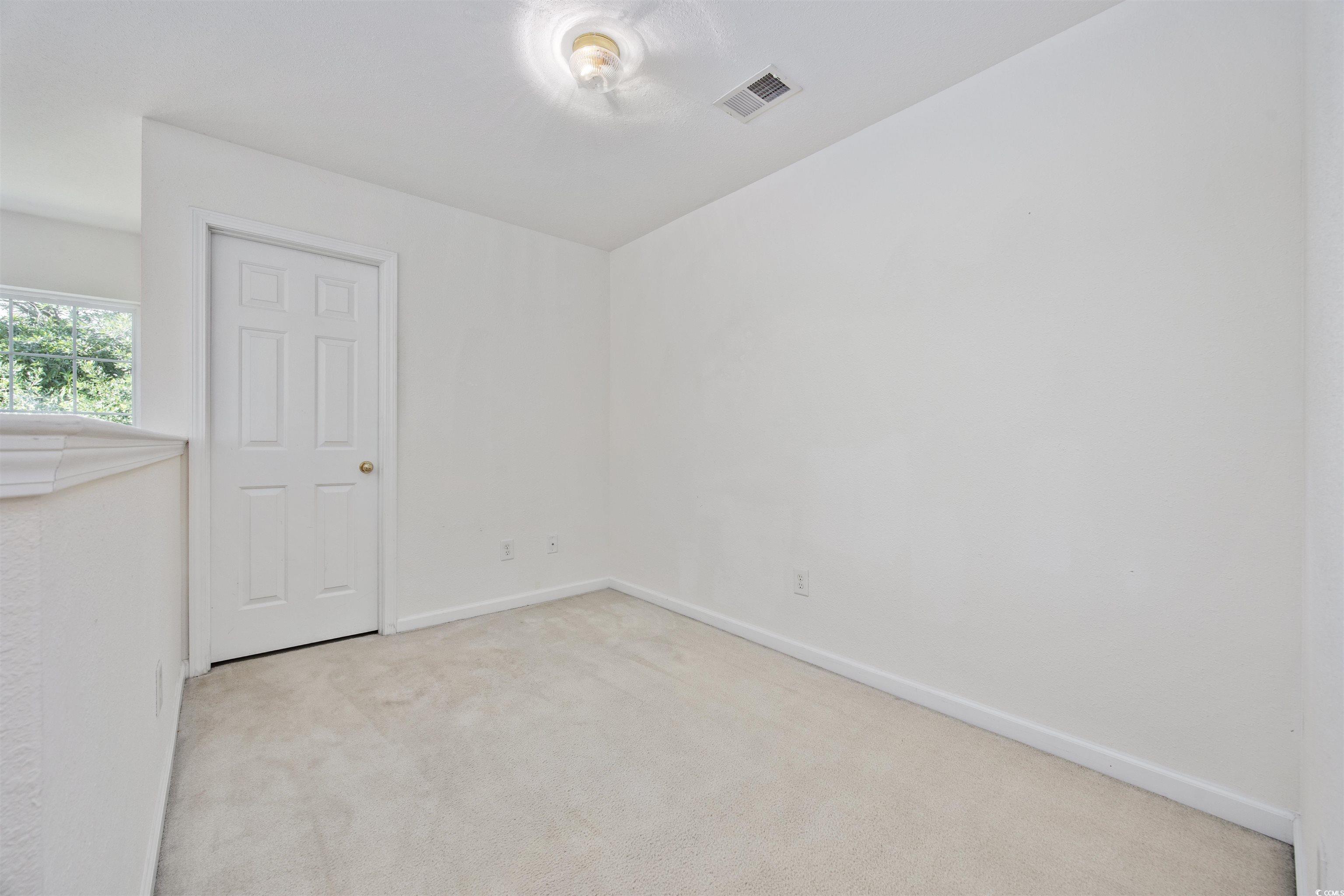 155 Chenoa Drive, Unit D Murrells Inlet, SC 29576 - Photo 19 of 33 Full bathroom featuring vanity, curtained shower, and tile patterned floors