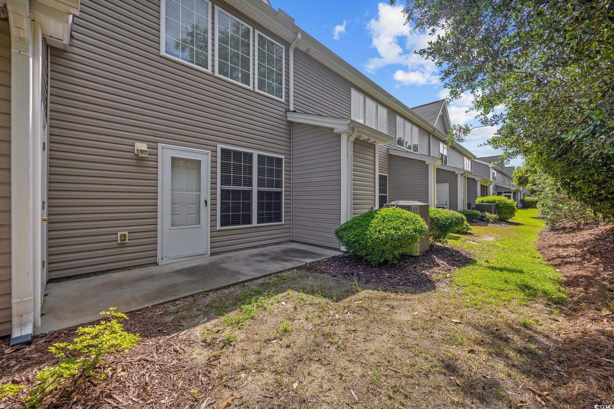 155 Chenoa Drive, Unit D Murrells Inlet, SC 29576 - Photo 23 of 33 Unfurnished bedroom with carpet, a closet, and a ceiling fan