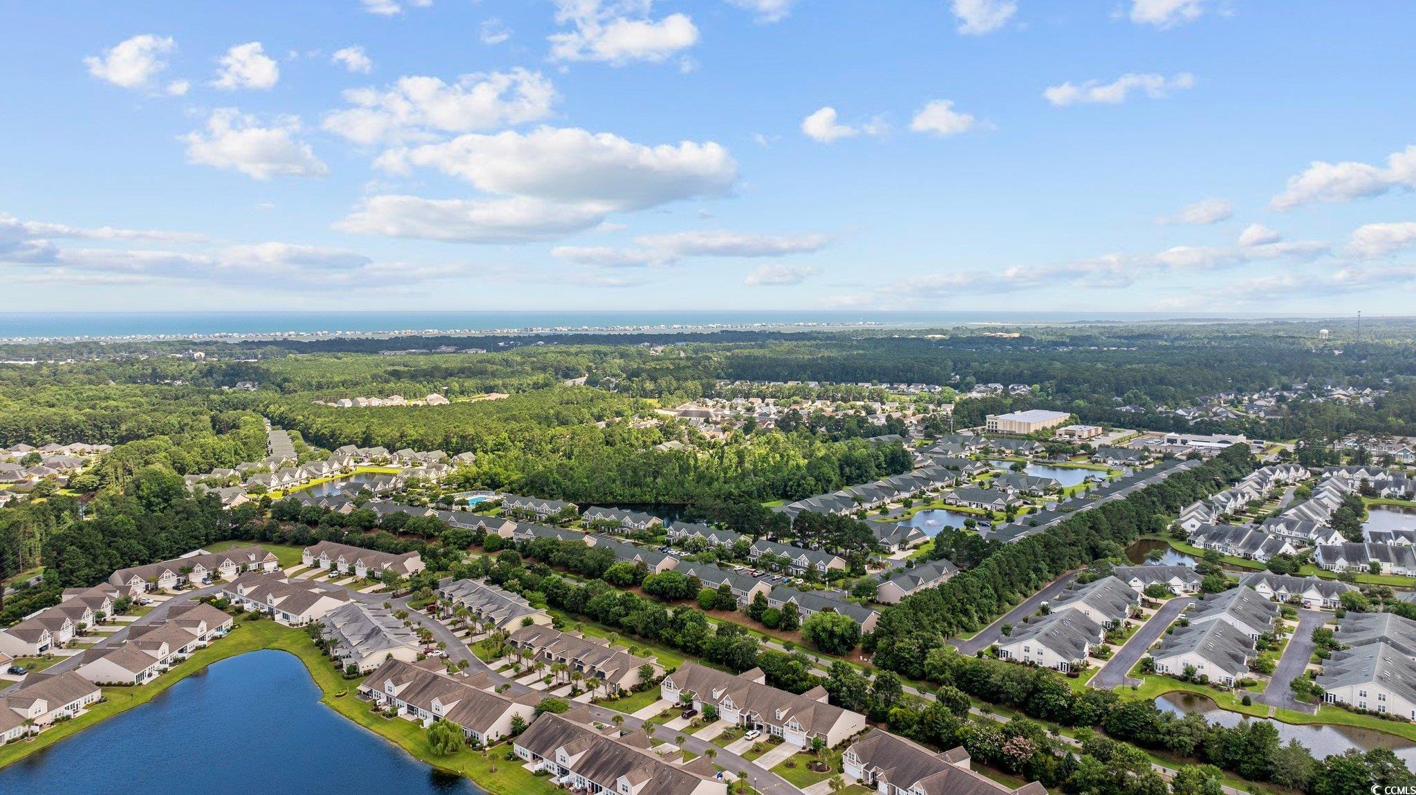 155 Chenoa Drive, Unit D Murrells Inlet, SC 29576 - Photo 27 of 33 Aerial perspective of suburban area featuring a nearby body of water