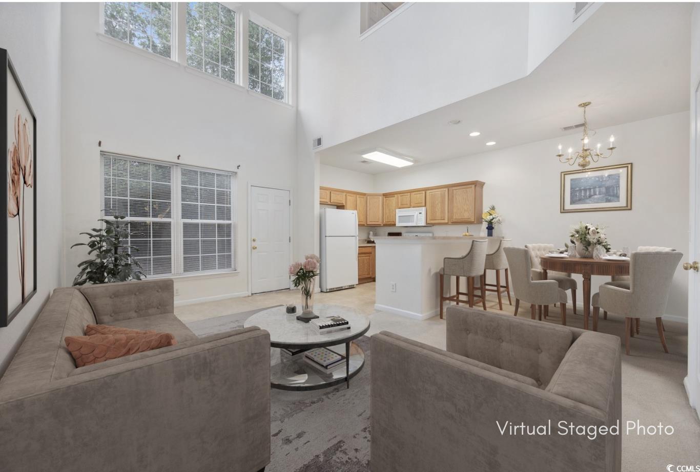 155 Chenoa Drive, Unit D Murrells Inlet, SC 29576 - Photo 2 of 33 Living area with baseboards and a chandelier