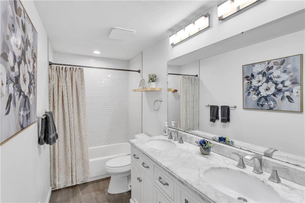 212 Seanor Road Irwin, PA 15642 - Photo 16 of 33 Full Bath with Updated Lighting, Marble Topped Dble Vanity, Tile Surround Tub/Shower. and Large Linen Closet.