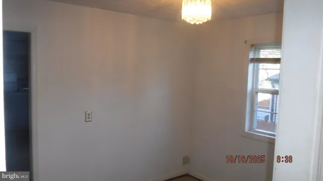 a view of an empty room and window