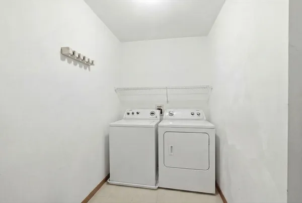 a view of a balcony with two chairs