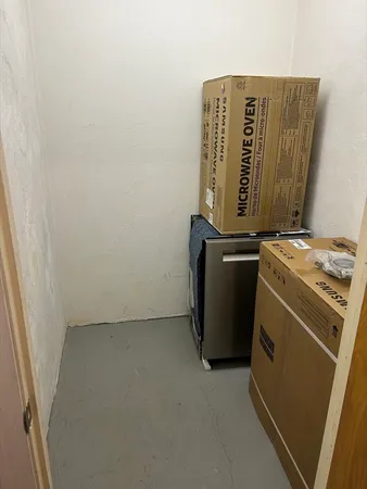 a view of a balcony with a table and chairs