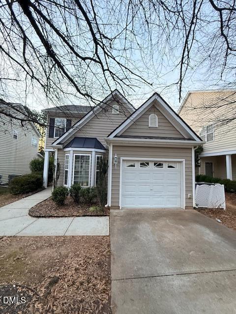 8427 Stone Mason Drive Raleigh, NC 27613 - Photo 1 of 28 a front view of a house with a yard and garage