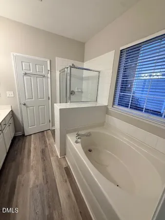 a view of a room with a ceiling fan