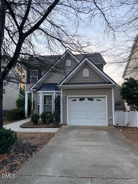 8427 Stone Mason Drive Raleigh, NC 27613 - Photo 3 of 28 a front view of a house with a yard and garage