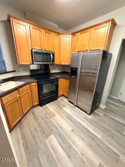 8427 Stone Mason Drive Raleigh, NC 27613 - Photo 5 of 28 a kitchen with stainless steel appliances granite countertop sink microwave and window