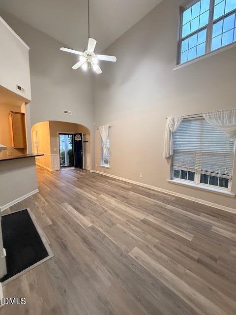 8427 Stone Mason Drive Raleigh, NC 27613 - Photo 9 of 28 a view of an empty room with window and wooden floor