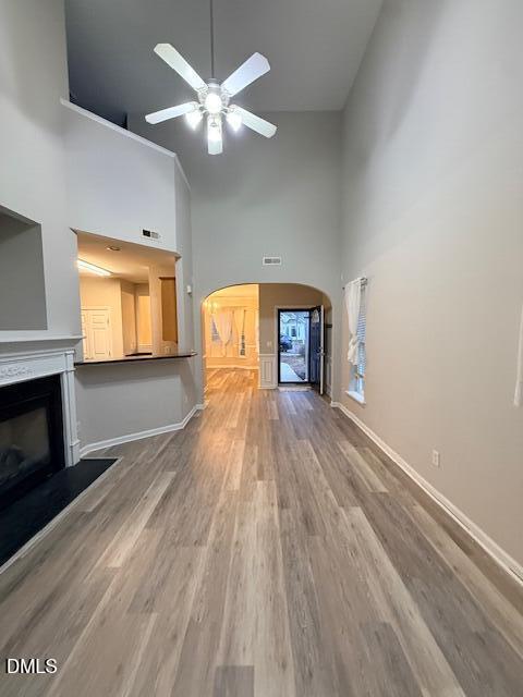 8427 Stone Mason Drive Raleigh, NC 27613 - Photo 10 of 28 a view of empty room with a fireplace and wooden floor