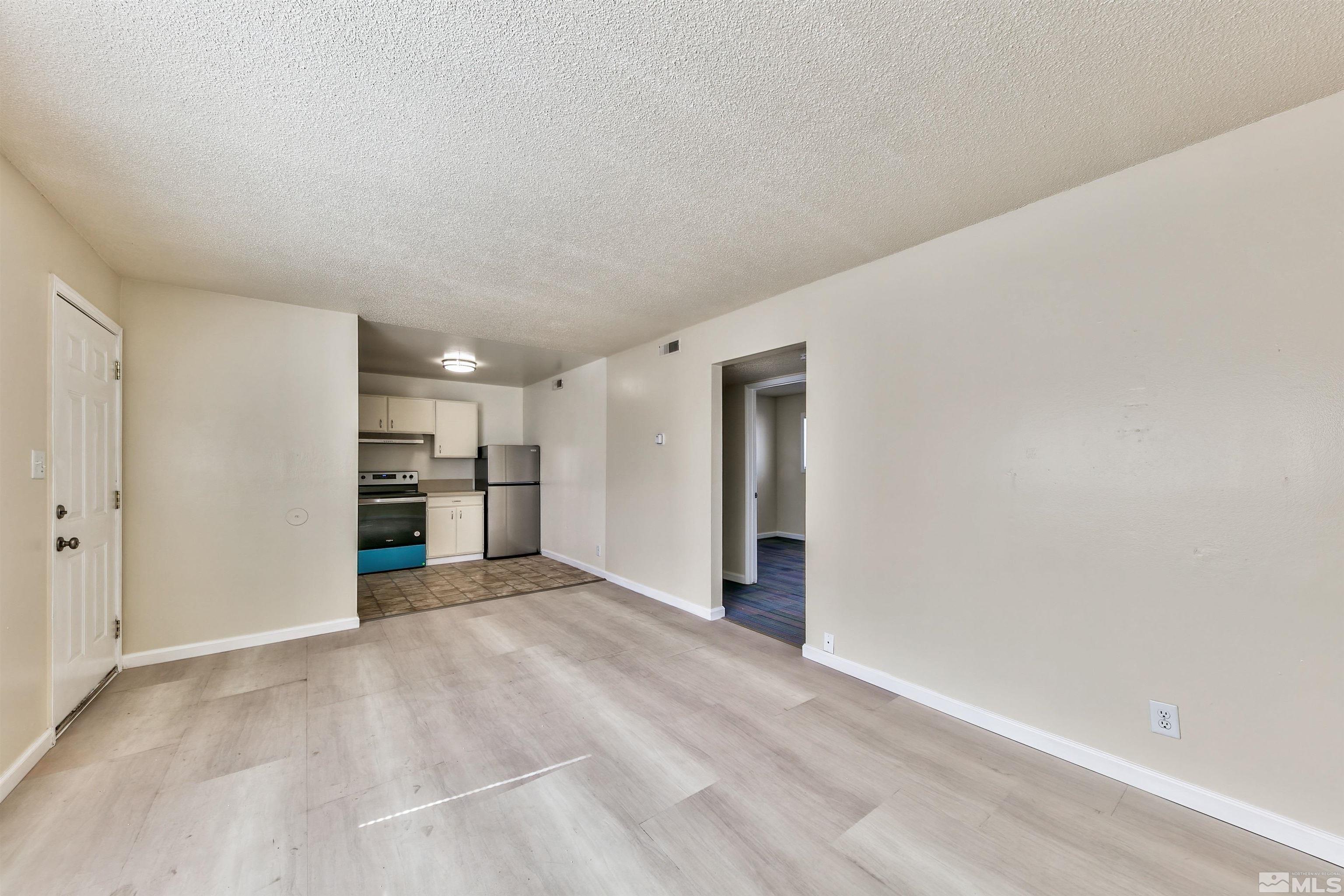 420 Lee Street Carson City, NV 89706 - Photo 12 of 29 a view of an empty room with closet and a window