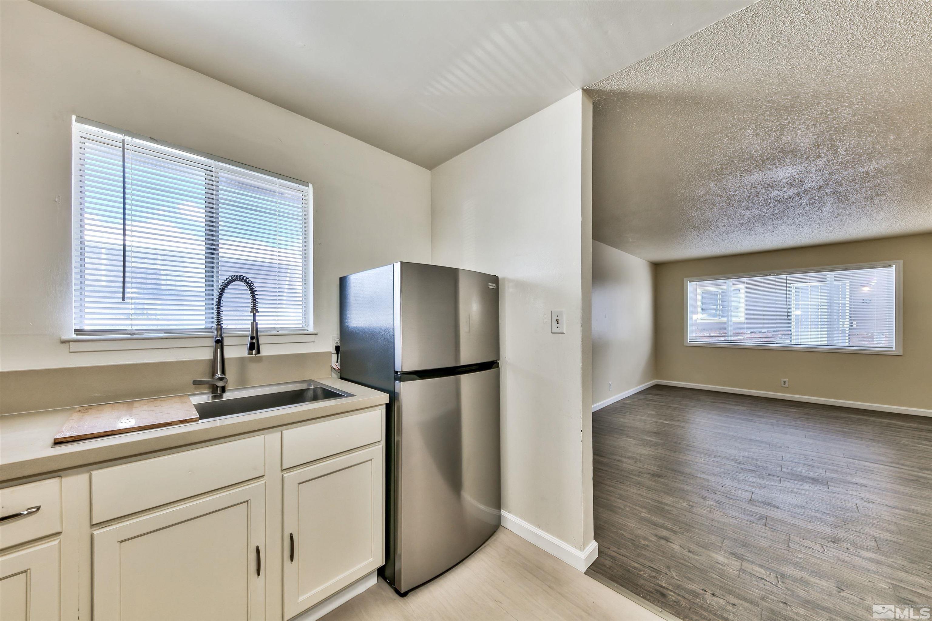 420 Lee Street Carson City, NV 89706 - Photo 14 of 29 a kitchen with a refrigerator and a sink