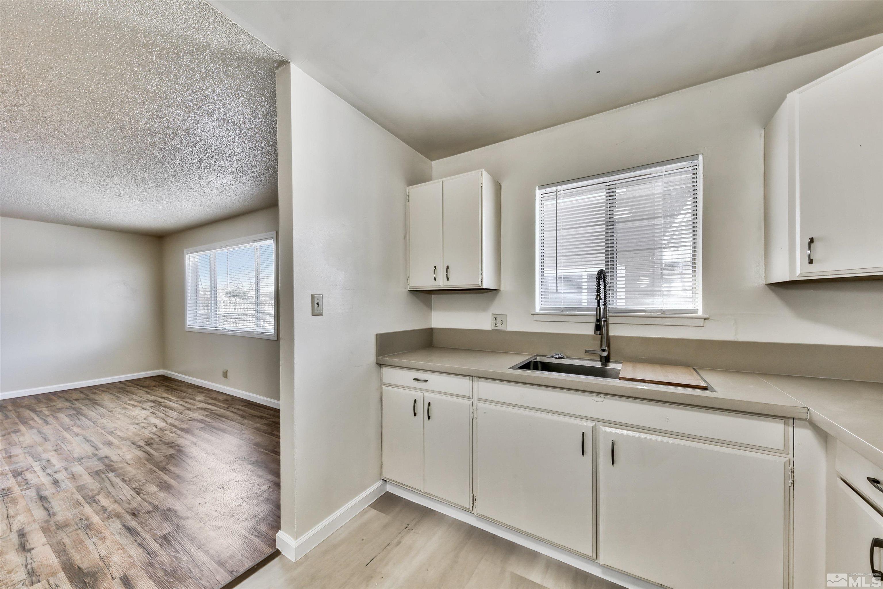 420 Lee Street Carson City, NV 89706 - Photo 17 of 29 a kitchen with cabinets appliances and a sink
