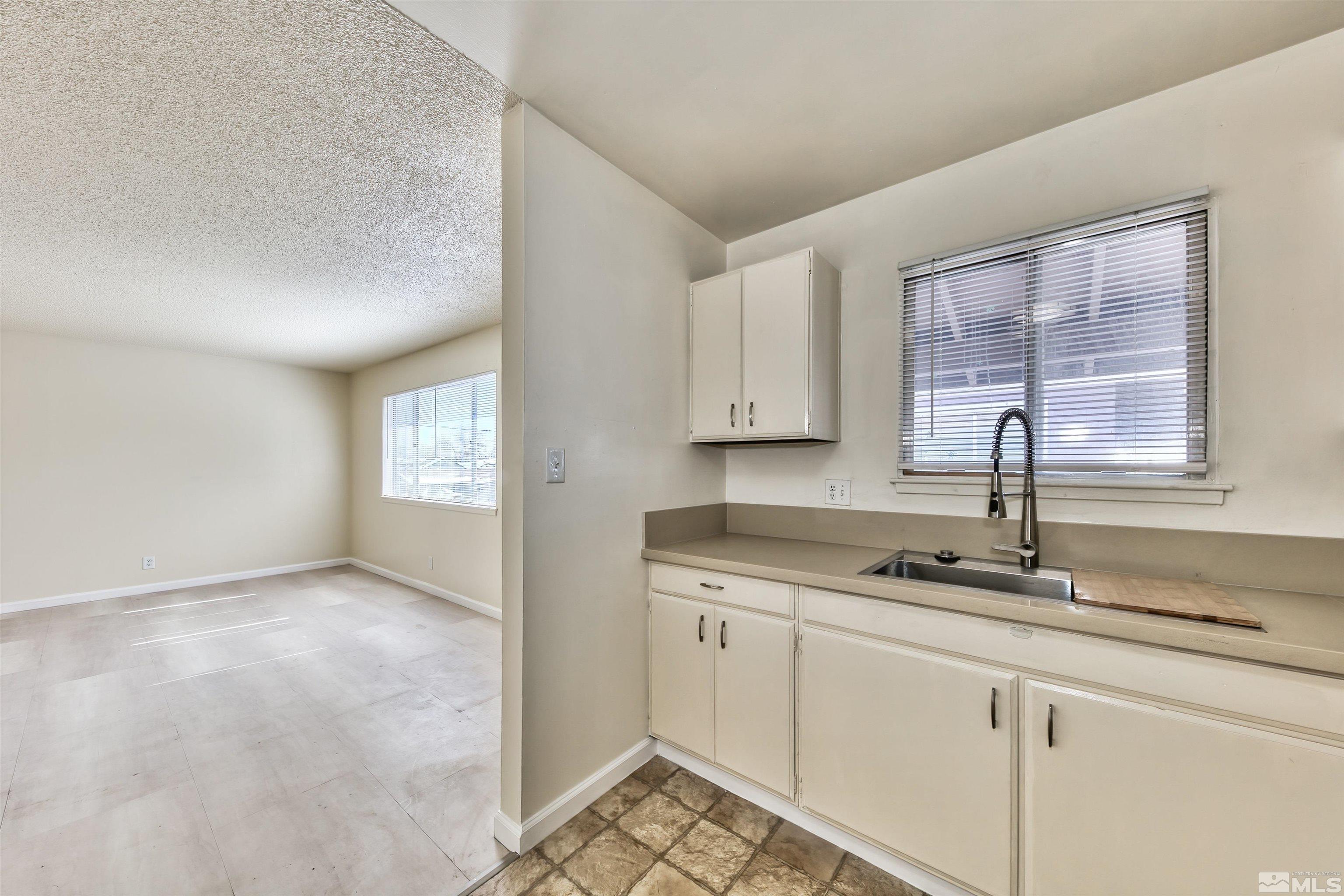 420 Lee Street Carson City, NV 89706 - Photo 19 of 29 a kitchen with a sink and cabinets