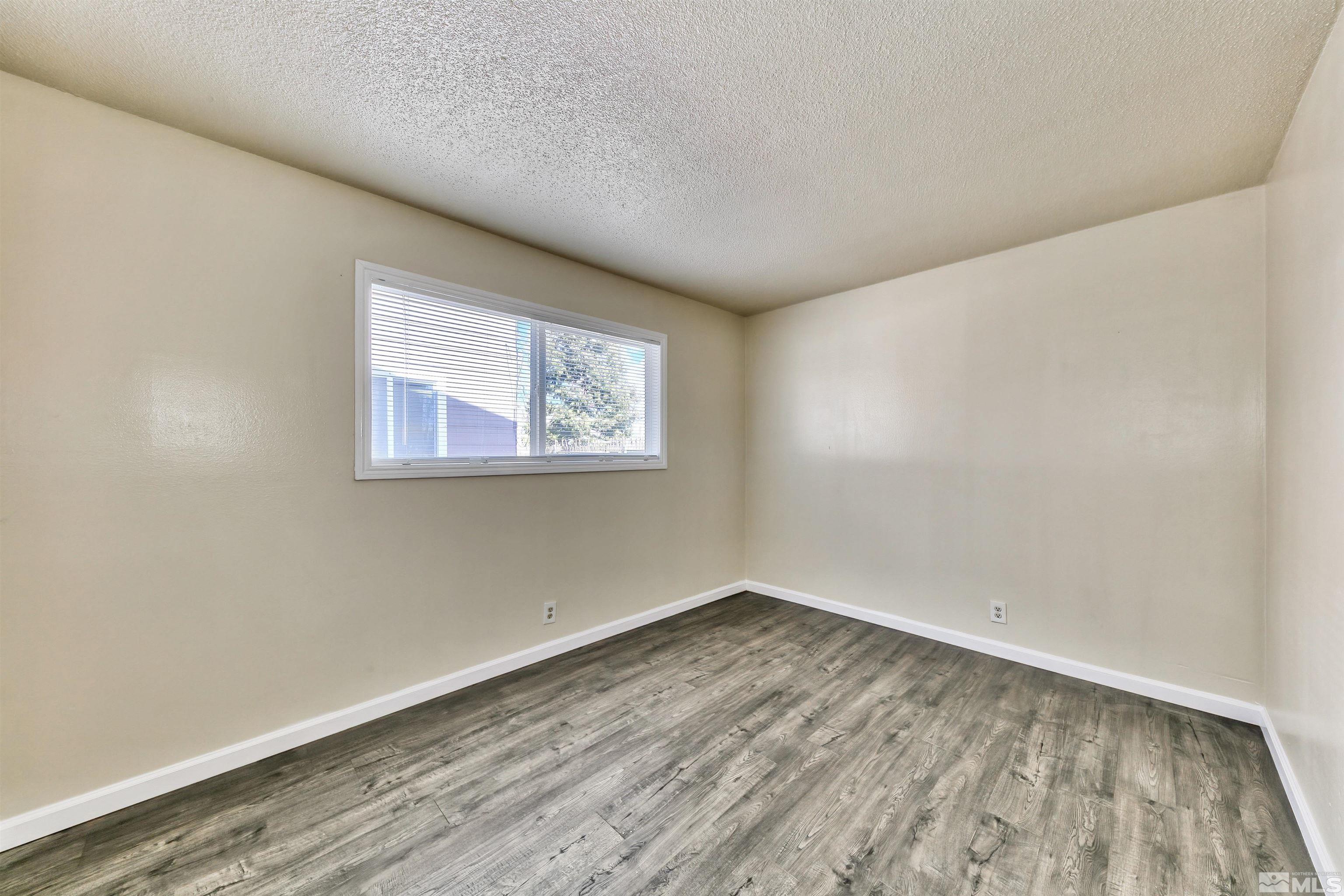 420 Lee Street Carson City, NV 89706 - Photo 21 of 29 a view of empty room with wooden floor