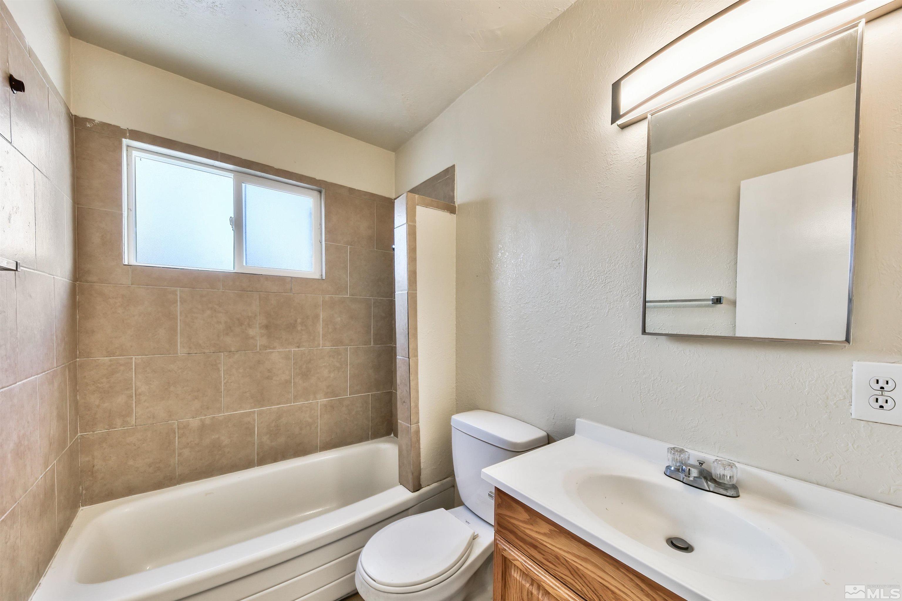 420 Lee Street Carson City, NV 89706 - Photo 28 of 29 a bathroom with a sink toilet and shower
