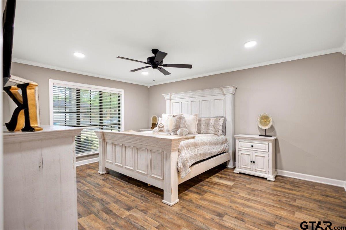 1701 Edgebrook Street Henderson, TX 75652 - Photo 14 of 36 a view of a bedroom with furniture and windows