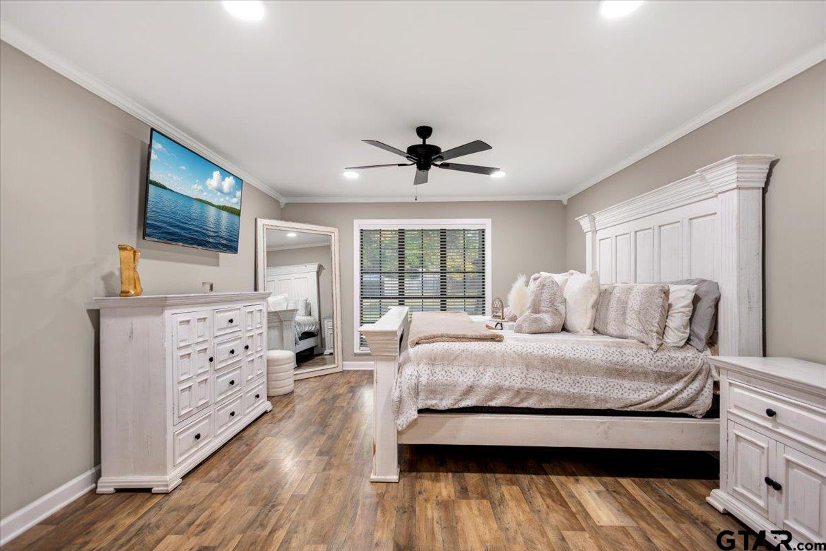 1701 Edgebrook Street Henderson, TX 75652 - Photo 15 of 36 a bedroom with a bed and a dresser