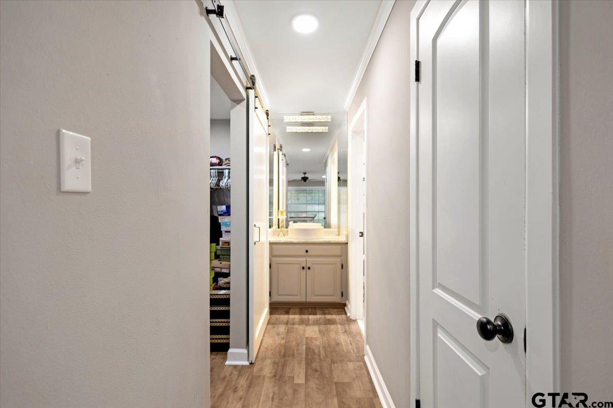 1701 Edgebrook Street Henderson, TX 75652 - Photo 17 of 36 a view of a hallway with wooden floor and closet