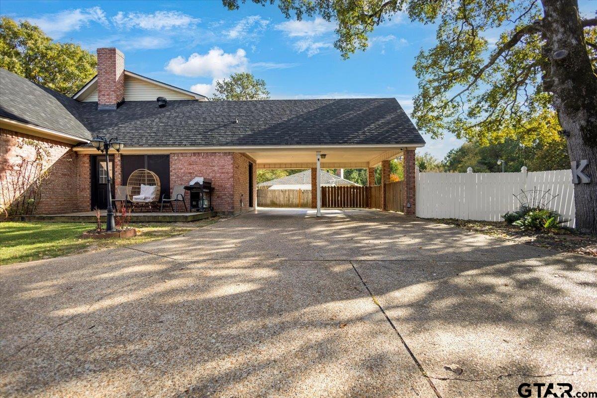 1701 Edgebrook Street Henderson, TX 75652 - Photo 27 of 36 a front view of house with yard