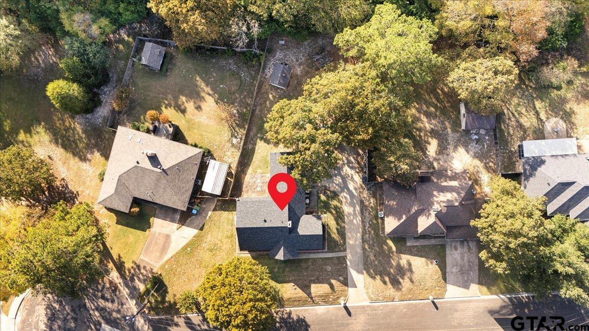 1701 Edgebrook Street Henderson, TX 75652 - Photo 32 of 36 a view of swimming pool with a yard and sitting area