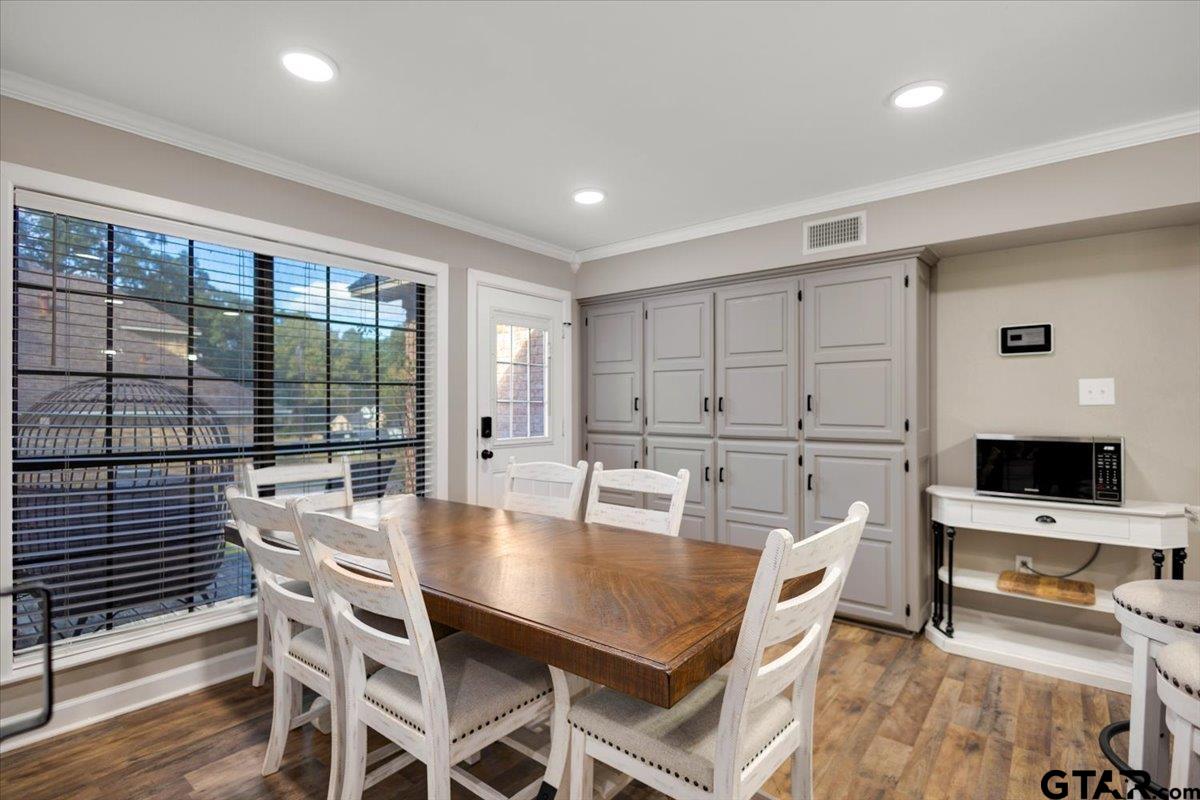 1701 Edgebrook Street Henderson, TX 75652 - Photo 10 of 36 a dining room with furniture and wooden floor
