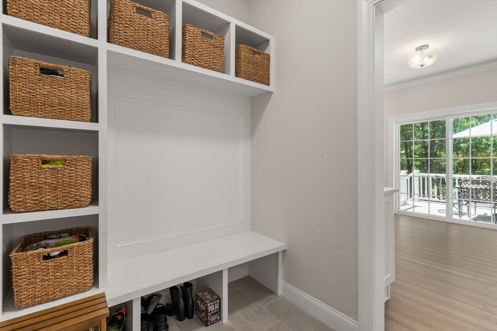275 Chestnut Street Hudson, MA 01749 - Photo 13 of 34 a view of a hallway with wooden floor and windows