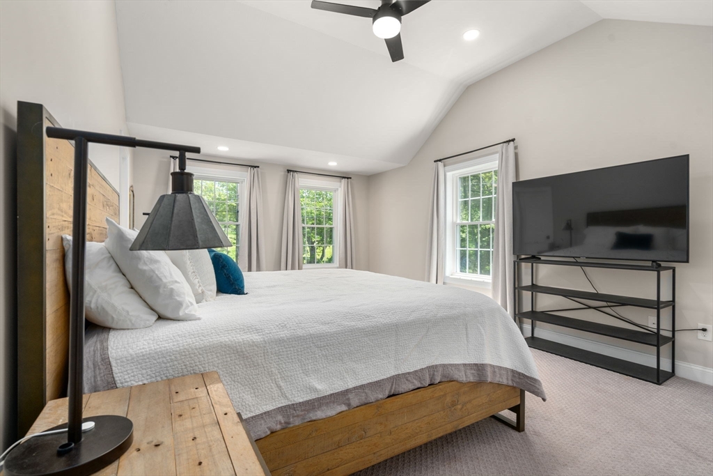 275 Chestnut Street Hudson, MA 01749 - Photo 14 of 34 a bedroom with a bed and flat screen tv