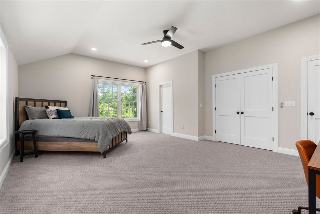 275 Chestnut Street Hudson, MA 01749 - Photo 21 of 34 a bedroom with a bed and a window
