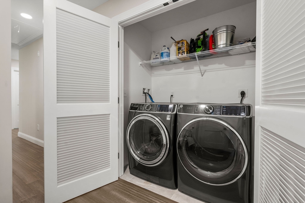 275 Chestnut Street Hudson, MA 01749 - Photo 24 of 34 a view of storage and utility room with washer and dryer