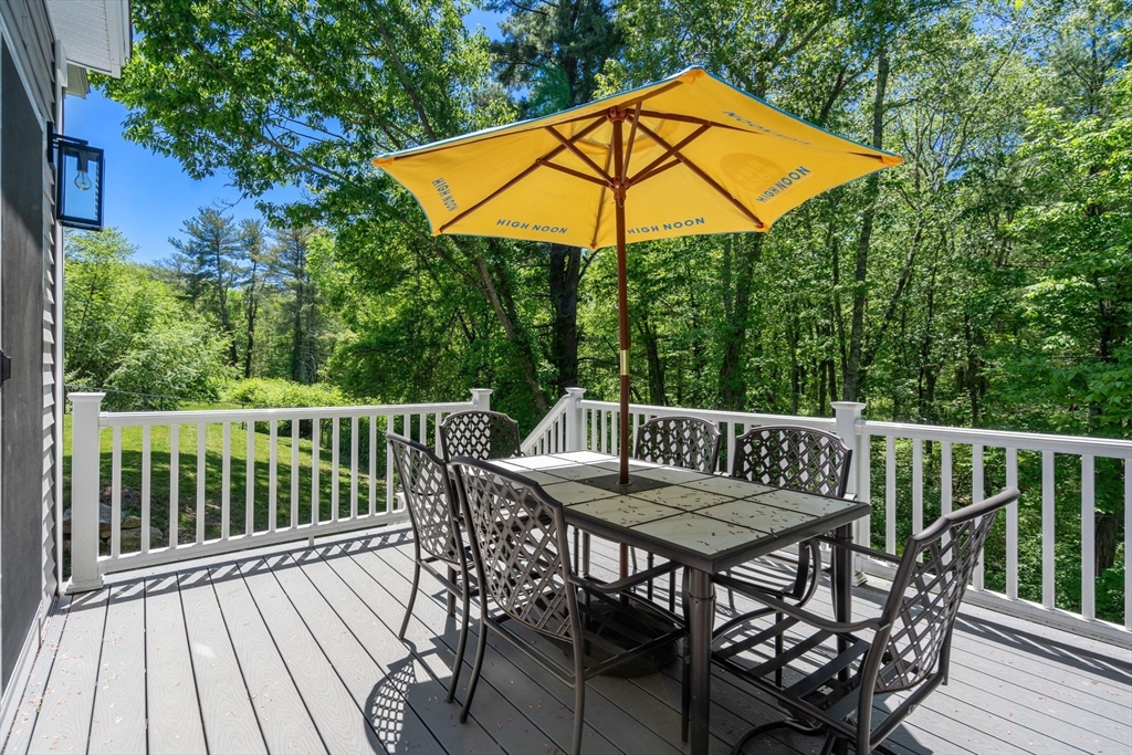 275 Chestnut Street Hudson, MA 01749 - Photo 27 of 34 a view of a wooden deck with furniture