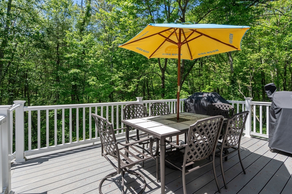 275 Chestnut Street Hudson, MA 01749 - Photo 28 of 34 a view of a chair and table on the deck