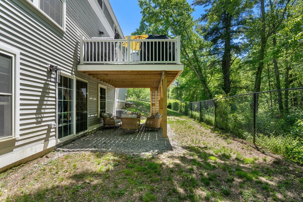 275 Chestnut Street Hudson, MA 01749 - Photo 30 of 34 a view of a house with backyard and sitting area