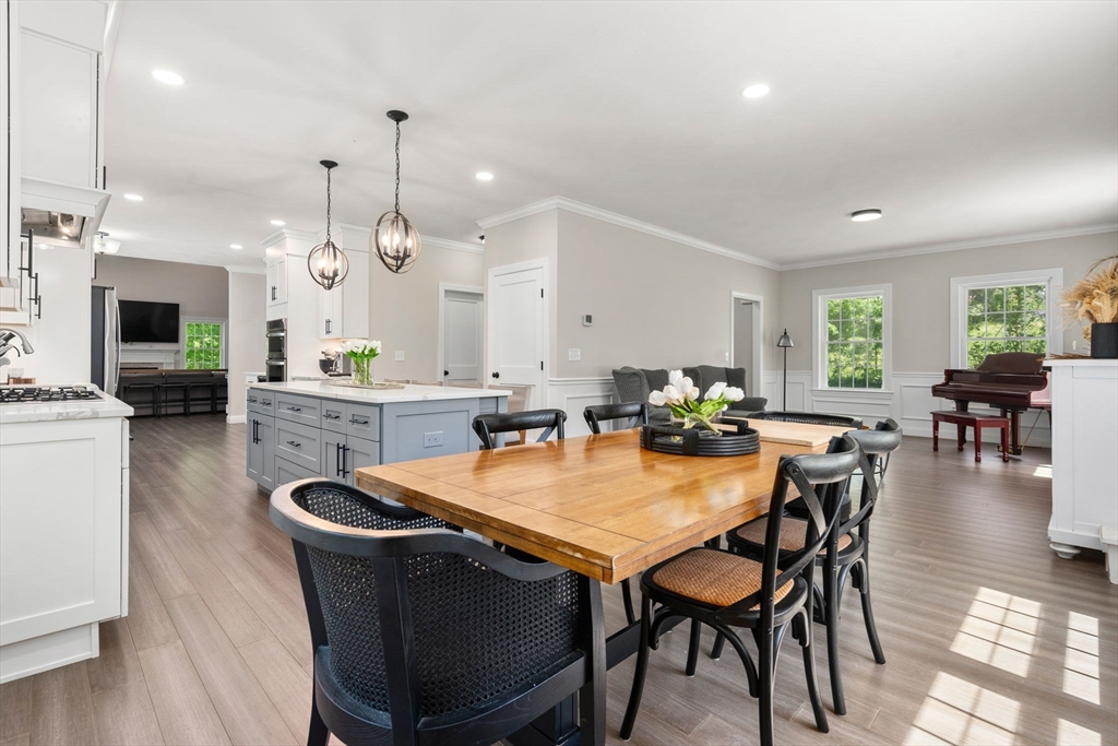 275 Chestnut Street Hudson, MA 01749 - Photo 3 of 34 a dining room with furniture and wooden floor