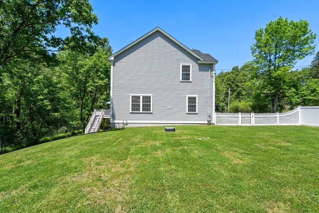 275 Chestnut Street Hudson, MA 01749 - Photo 33 of 34 a view of a house with backyard